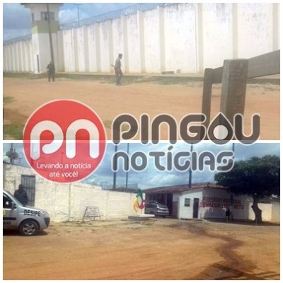 Dupla � flagrada tentando arremessar objetos para dentro do Pres�dio de Gl�ria (Imagem: Pingou Not�cias)